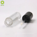 empty round plastic clear lipstick container with black cap